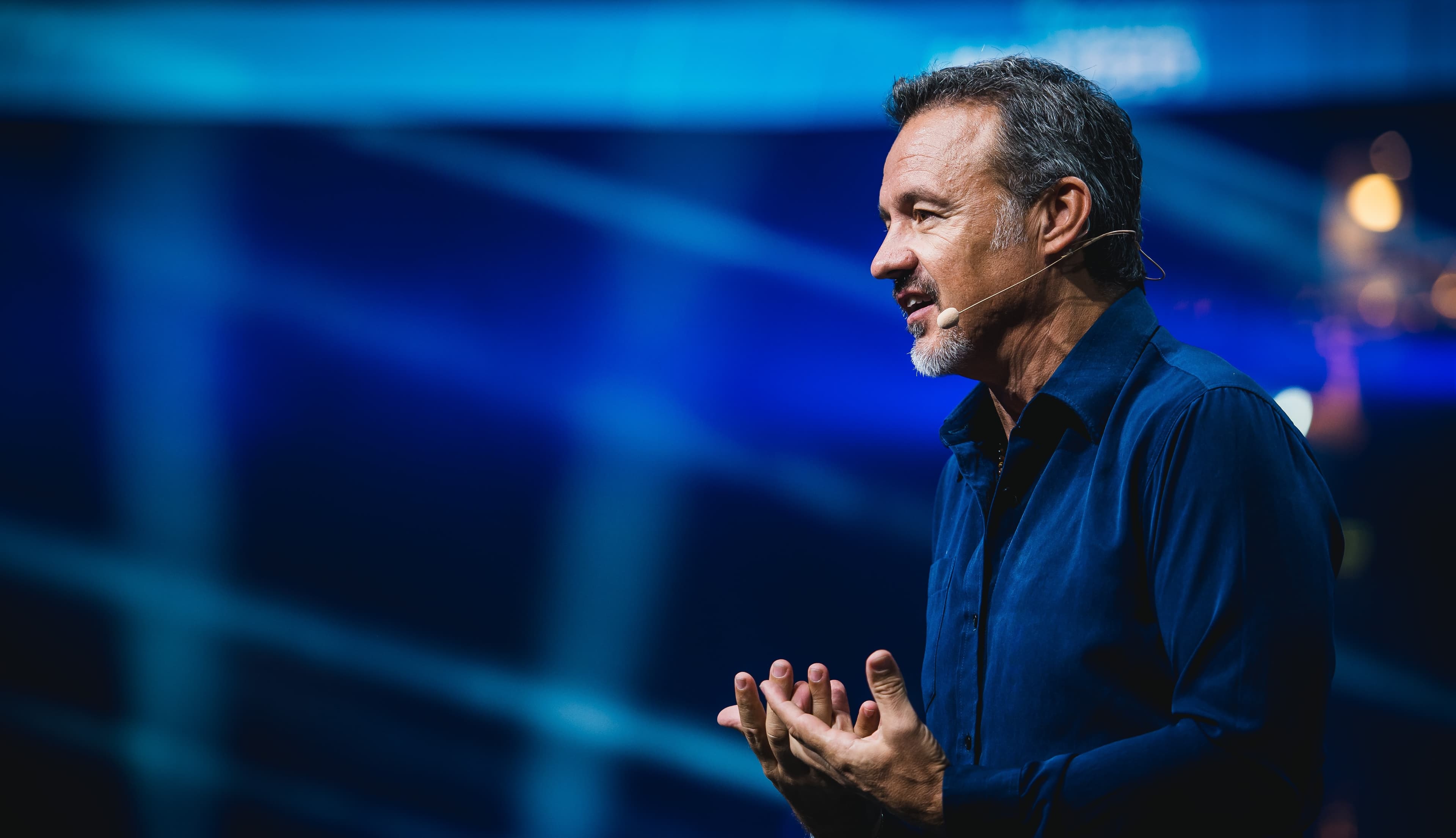 Eric Edmeades speaking on stage